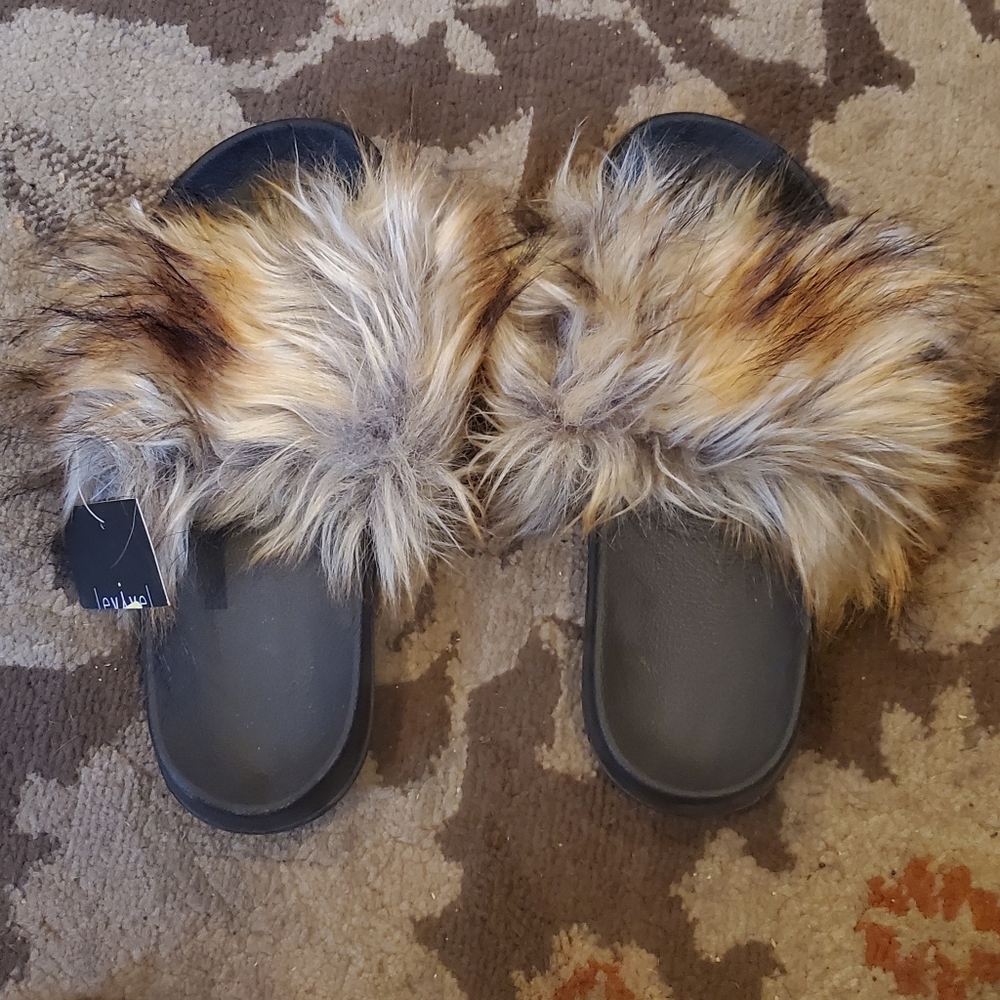 Comfy brown and beige faux fur slides.